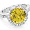 Sunrise - large yellow sapphire fine diamond halo ring