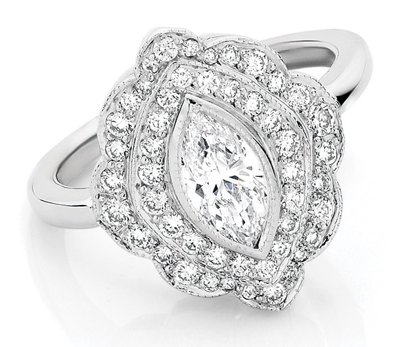 engagement ring of marquise cut diamond with a double row of grain set diamonds enhanced by millegraine detailing