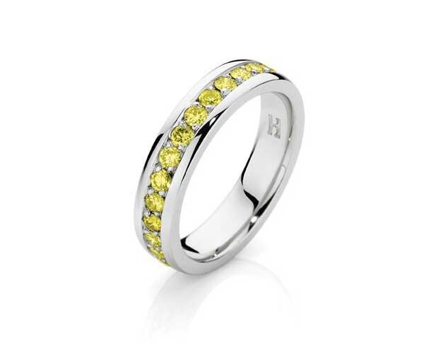 half circle of channel set round yellow diamonds in 18ct white gold