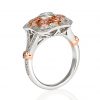dress ring of pink diamonds in a floral vintage style around a bezel set diamond